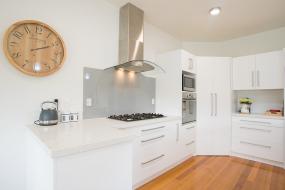 White Kitchen with Stainless Steel Appliances