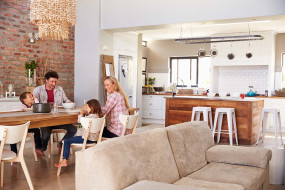 Family enjoying a meal together set in an accessorised kitchen