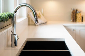 stainless steel tap over a double-basin sink