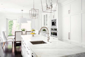 Traditional white and steel kitchen with stone benchtop and plenty of storage space