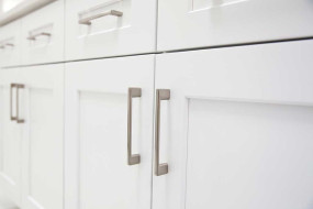 White doors and drawers style with stainless steel handles